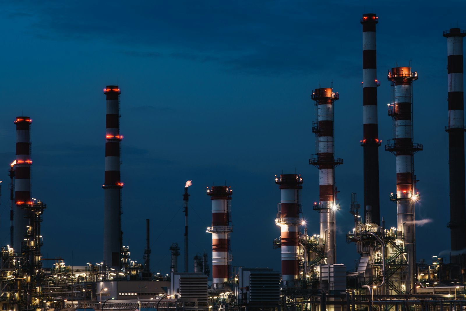 Industrial facility lit at dusk