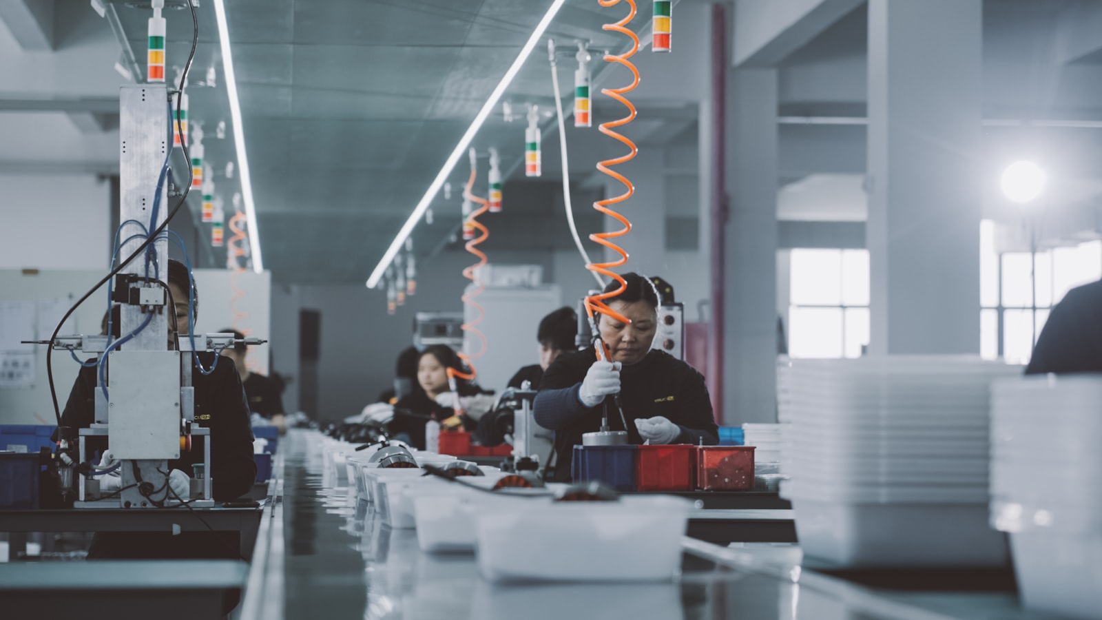 Technicians working on a manufacturing line